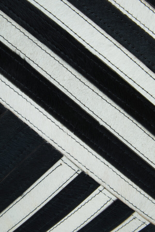 Bosie Safira Black and White Hair on Leather Cushion