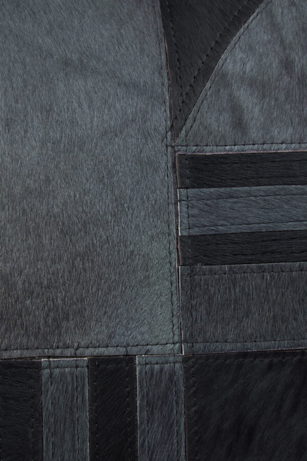 Bosie Safira Black And Grey Hair on Leather Cushion